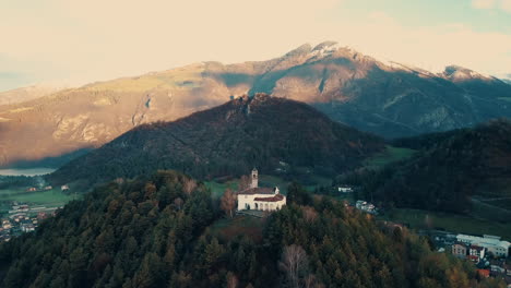 Aerial-footage-of-small-city-between-Italian-Alps