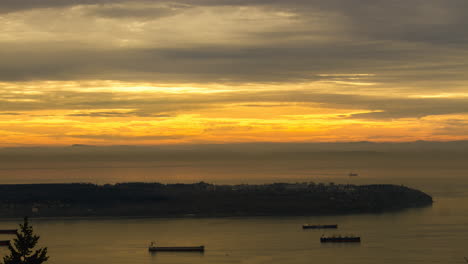 Sunset-Clouds-Flying-Over-Peninsula-Campus-with-Cargo-Ships-Timelapse