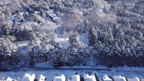 Drone-flyover-of-snowfall-on-Raleigh-NC-roads-and-houses