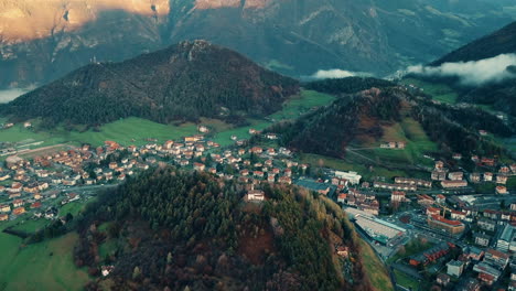 Aerial-footage-of-small-city-between-Italian-Alps