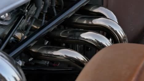 Slow-Motion-Hot-Rod-V8-Engine-Exhaust-Pipes-Close-Up,-Ace-Cafe-London