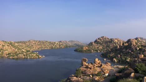Drone-Aerial-View-of-a-beautiful-lake-in-Hampi-India