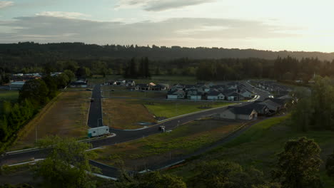 Drone-shot-with-a-smooth-camera-pan-of-a-small-town-at-sunset