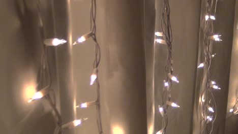 White-Christmas-Lights-Along-a-White-Curtain