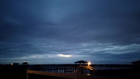 Night-time-lapse-of-Wrightsville-beach-North-Carolina-shore-and-cars-passing-by