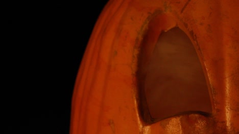 Close-Up-of-Smoking-Jack-O-Lantern-Eye-With-Flickering-Pumpkin-Light-Halloween