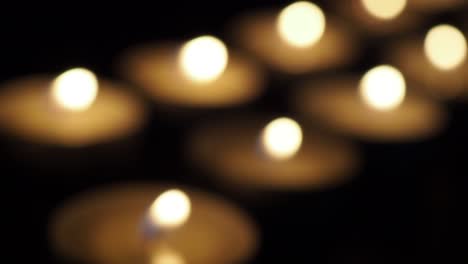 Candles-in-the-dark-out-of-focus-close-up
