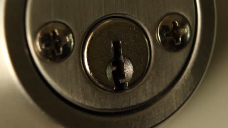 Key-Inserted-into-Deadbolt-Door-Lock-and-Turned-to-Right-Quickly-and-Removed-Residential-Close-Up