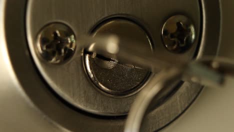 Key-Inserted-into-Deadbolt-Door-Lock-and-Turned-to-Right-and-Removed-Residential-Close-Up