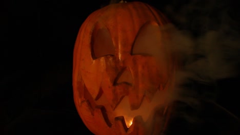 Smoking-Tall-Jack-O-Lantern-With-Flickering-Pumpkin-Light-Halloween-Centered-Wide-Angle-Lens