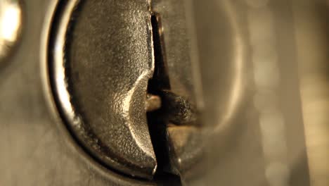 Key-Inserted-into-Deadbolt-Door-Lock-and-Removed-Residential-Extreme-Close-Up