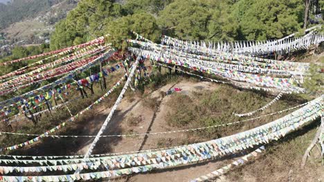 Drone-Aerial-View-of-Monastery-Buddhist-peaceful-flags-flying