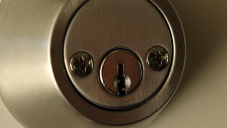 Key-Inserted-into-Deadbolt-Door-Lock-Residential-Medium-Close