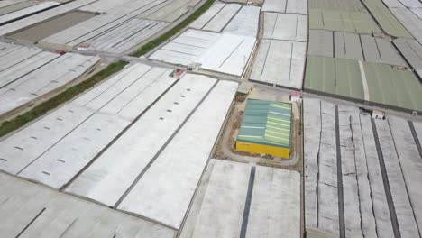 Aerial-view-over-a-farmland-of-greenhouses-with-white-plastics-in-Almeria