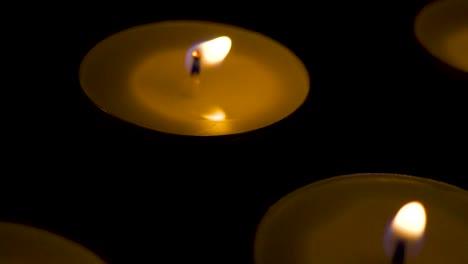 Candles-in-the-dark-dolly-slide-macro-close-up