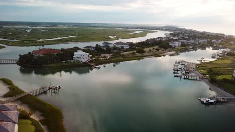 Early-morning-sunrise-drone-flyover-of-inner-harbor-and-marsh-wetlands-on-figure-eight-island-in-Wilmington-North-Carolina