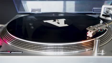 Close-up,-Modern-Turntable-With-Rotating-Vinyl-Record,-DJ-Gear,-Equipment,-A-Side-played