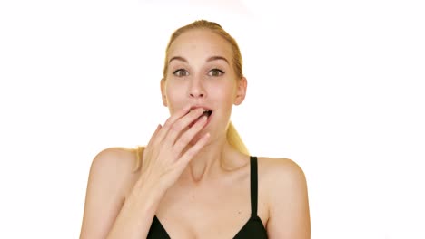 Shocked-blond-woman-on-a-white-studio-background-shows-positive-astonishment