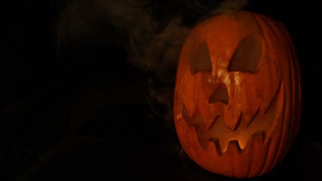 Smoking-Tall-Jack-O-Lantern-With-Flickering-Pumpkin-Light-Halloween-Framed-Right-Wide-Angle-Lens