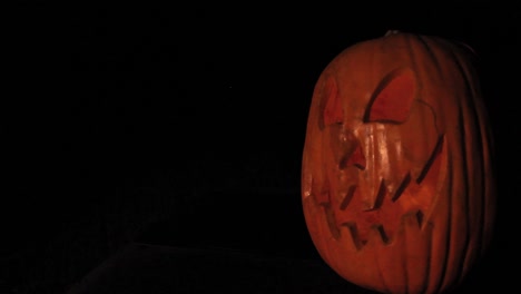 Tall-Jack-O-Lantern-Angled-With-Flickering-Pumpkin-Light-Halloween-Framed-Right