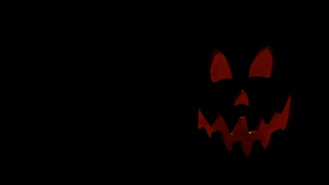 Tall-Jack-O-Lantern-Silhouette-With-Flickering-Pumpkin-Light-Halloween-Framed-Right