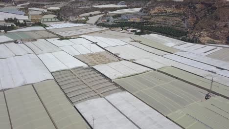 Aerial-panoramic-shot-of-a-greenhouse-land-in-Almeria,-Spain