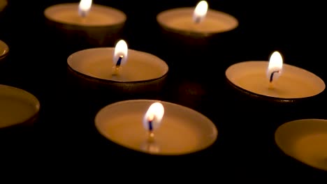 Candles-in-the-dark-rotating-slide-macro-dolly-close-up