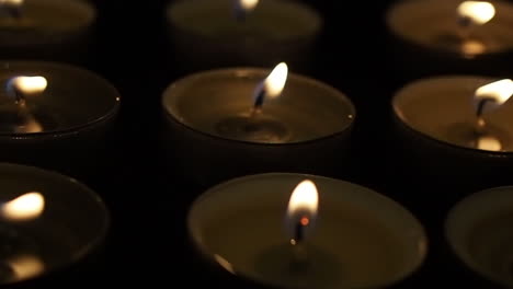 Candles-in-the-dark-slow-motion-dolly-slide-macro-close-up