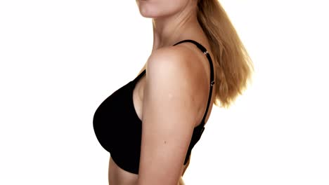Close-up-of-a-woman's-torso-with-big-breasts-in-a-black-bra