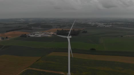 Aerial-view-of-wind-turbines-generating-power-during-a-cloudy-morning-sunrise-following-a-early-morning-storm