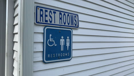restroom-sign-on-the-side-of-a-public-building-in-Cape-Cod