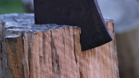 An-axe-chopping-into-a-wooden-log.-CU
