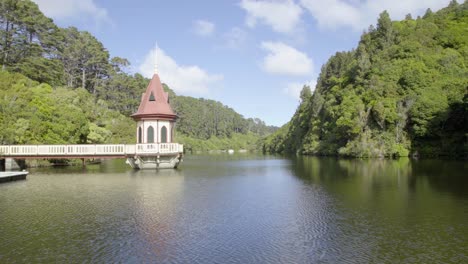 A-shot-of-the-lake-and-tower-in-Zealandia-in-Wellington,-New-Zealand