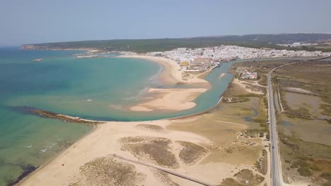 Aerial-view-of-the-white-town-of-Barbate-in-Cadiz-with-the-beach-and-the-hill-behind