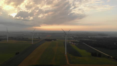 Aerial-view-of-wind-turbines-generating-power-during-beautiful-morning-sunrise-following-a-early-morning-storm