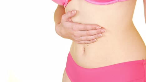 Woman-belly-closeup-on-white-studio-background