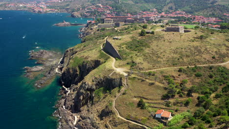 Aerial-shot-near-the-historical-town-and-port-of-Collioure-and-the-French-Spanish-border-at-the-Mediterranean-Sea