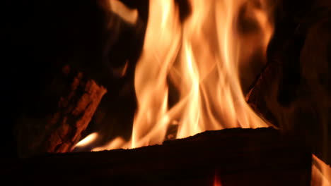 Fireplace-close-up-of-timber-logs-burning-with-flames