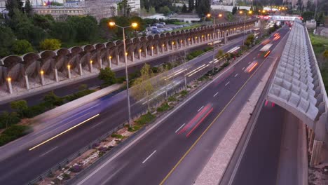 Time-Lapse-Evening-Sunset-of-the-Begin-Road-in-Jerusalem,-Cars-passing-by-Fastly