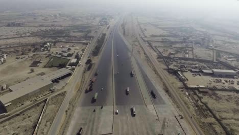 A-top-view-of-a-motorway-toll-plaza-of-the-city,-Heavy-vehicles-and-others-moving