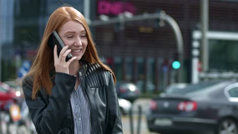 A-Beautiful-Brunette-Smiling-On-The-Phone-On-The-Peaceful-City-Streets---Slow-Motion