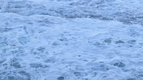 4k-Closeup-Of-Sea-Water-Crashing-Along-The-Coast-Waves-Breaking