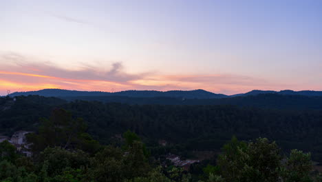 Sunrise-time-lapse-in-the-summer-over-a-valley-surrounded-by-mountains-in-the-Cote-d'Azur-region-in-France