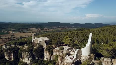 Aerial-view-of-the-castle-ruins-and-church-of-Vilademager-in-Catalonia,-Spain,-Europe