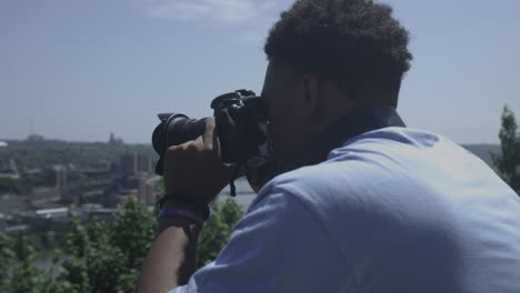 African-American-male-taking-photos-of-a-scenic-overlook-stabilized-shot-in-4K-UHD