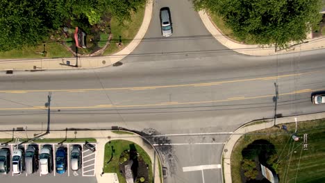 Top-down-aerial-of-road,-traffic,-shops-in-Village-of-Intercourse,-Pennsylvania,-Lancaster-County