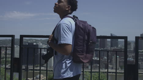 African-American-male-tourist-walking-and-enjoying-city-views-stabilized-shot-in-4K-UHD