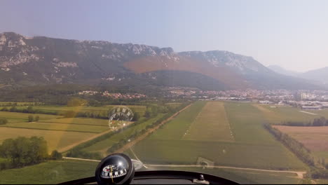 POV-of-airplane-landing-on-runway-in-countryside