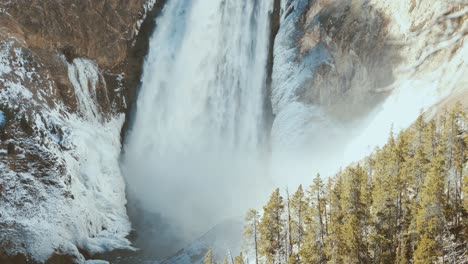 Yellowstone-falls-with-ice-and-snow,-narrow-shot