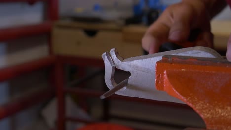 Sanding-Aluminum-Part-Clamped-in-Vice-With-Hand-File-in-Workshop-4K